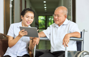 woman talking with senior man